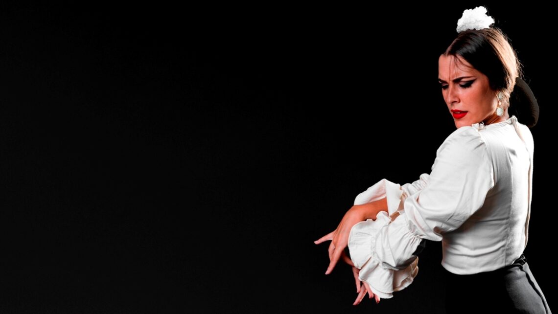 Woman dancing flamenco with copy space